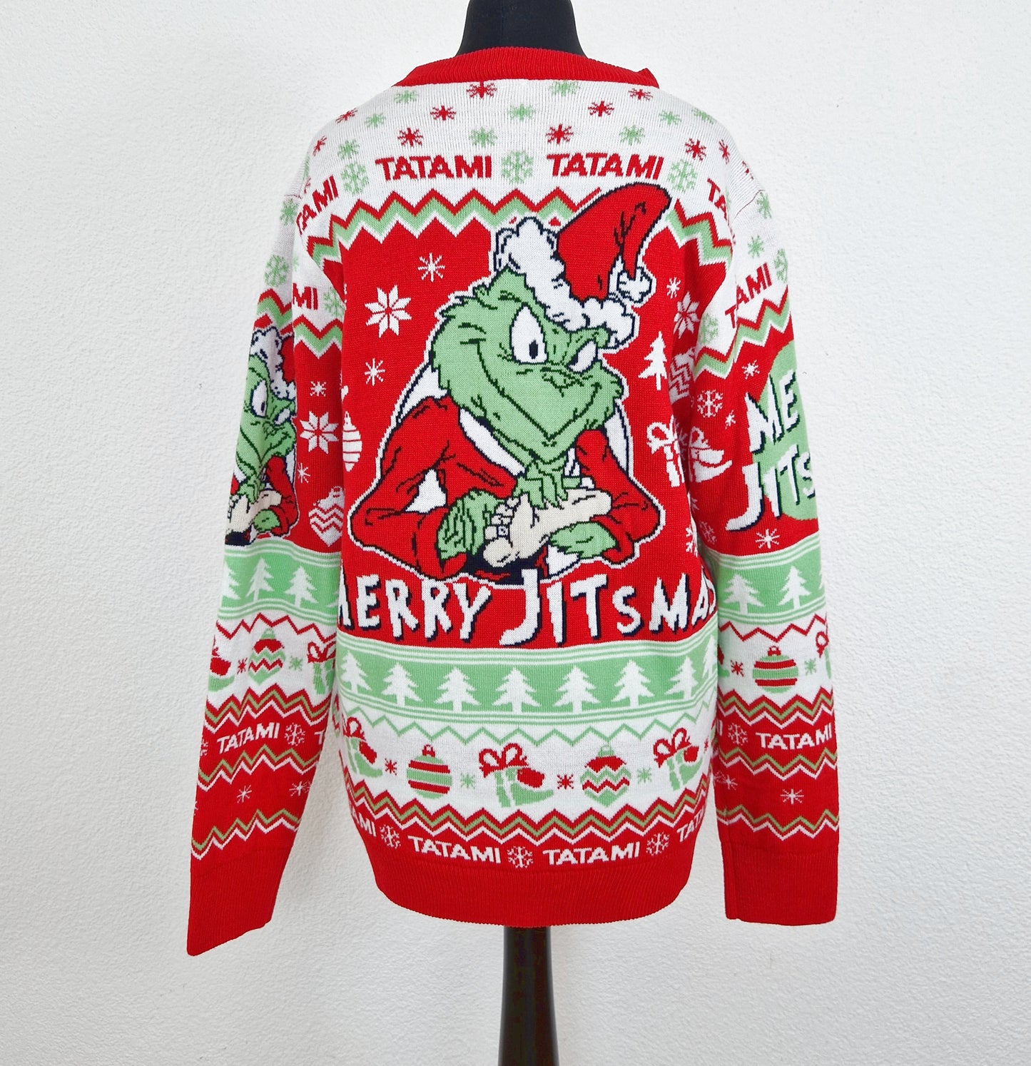 Einzigartiger und nachhaltiger Vintage Pullover in rot-weiss-hellgrün, Grinch. Unique and sustainable vintage pullover in red-white-light green, Grinch. Back.