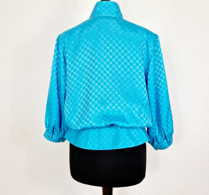 Einzigartige und nachhaltige Vintage Bluse in türkis. Unique and sustainable vintage blouse in turquoise. Back.