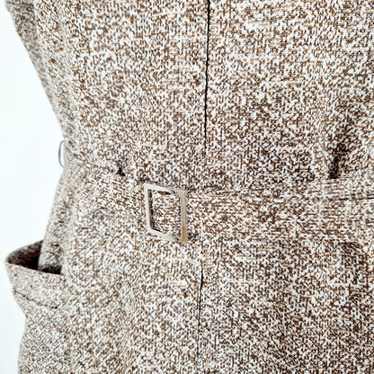 Einzigartiges und nachhaltiges Vintage Kleid in braun-beige meliert. Unique and sustainable vintage dress in brown-beige, mottled. Close-up.