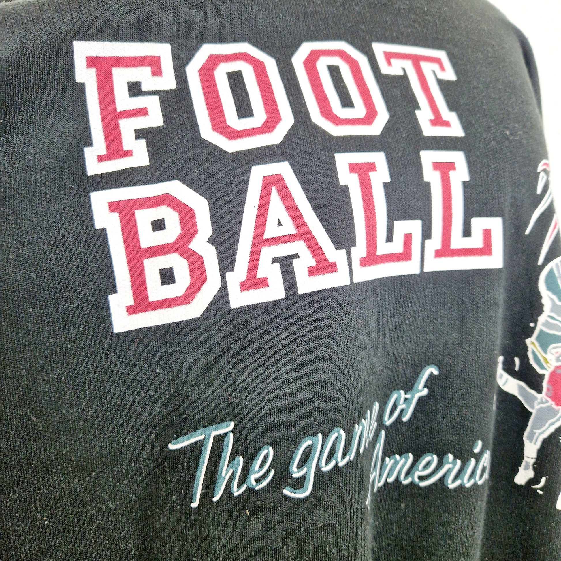 Einzigartiger und nachhaltiger Vintage Sweater, Football. Unique and sustainable vintage sweater, Football. Close-up.