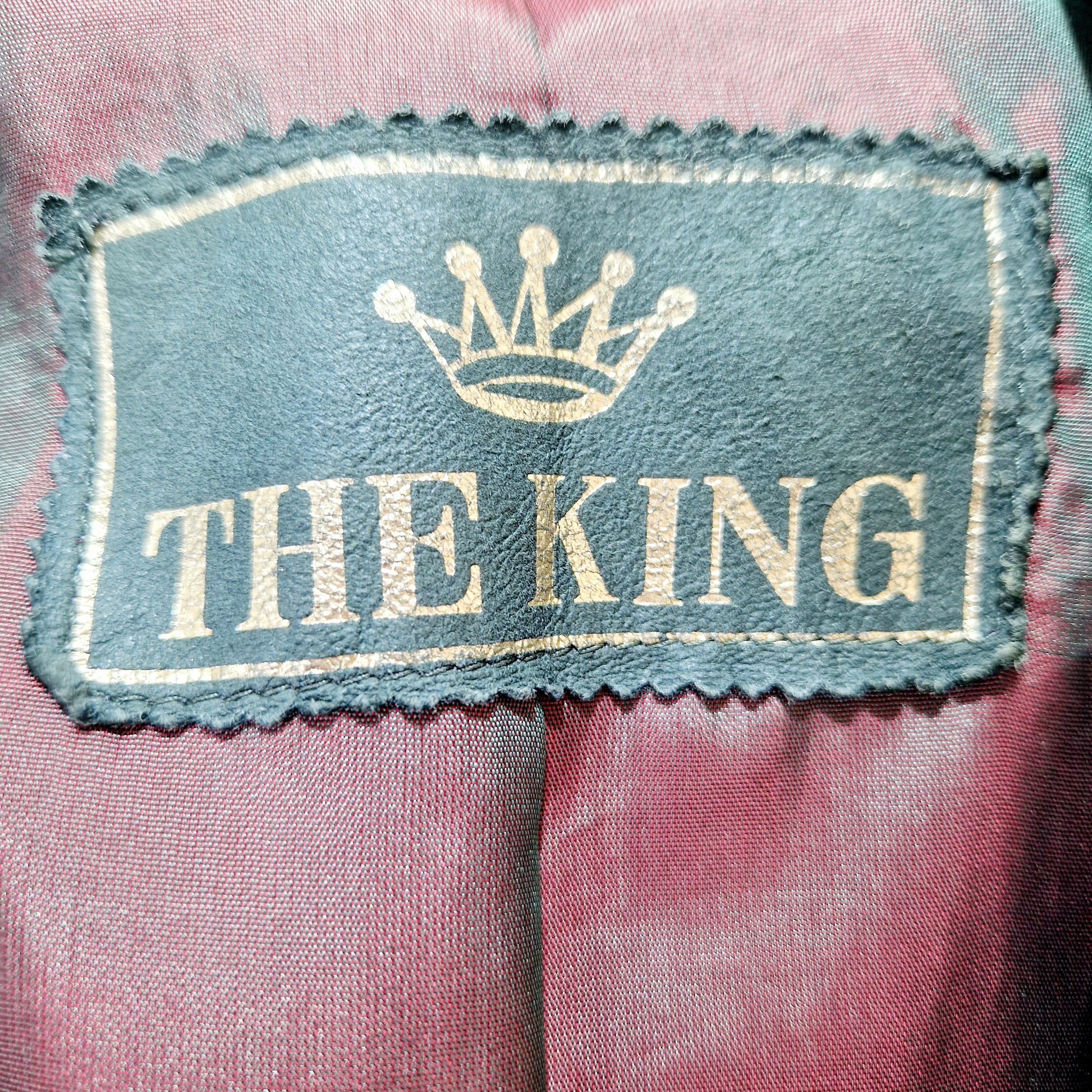 Einzigartiger und nachhaltiger Vintage Blazer in grün, Leder. Tag.