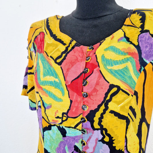 Einzigartiger und nachhaltiger Vintage Playsuit in orange-rot-violett mit Blumen. Close-up.