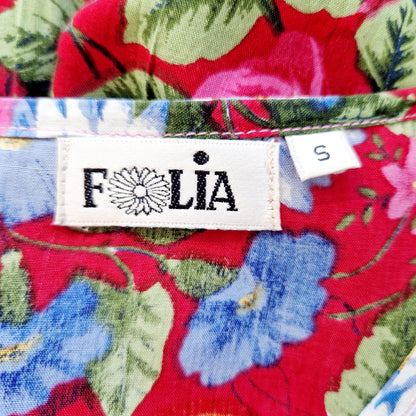 Einzigartiger und nachhaltiger Vintage Playsuit in pink-blau-weiss mit Blumen. Unique and sustainable vintage playsuit in pink-blue-white with flowers. Tag.