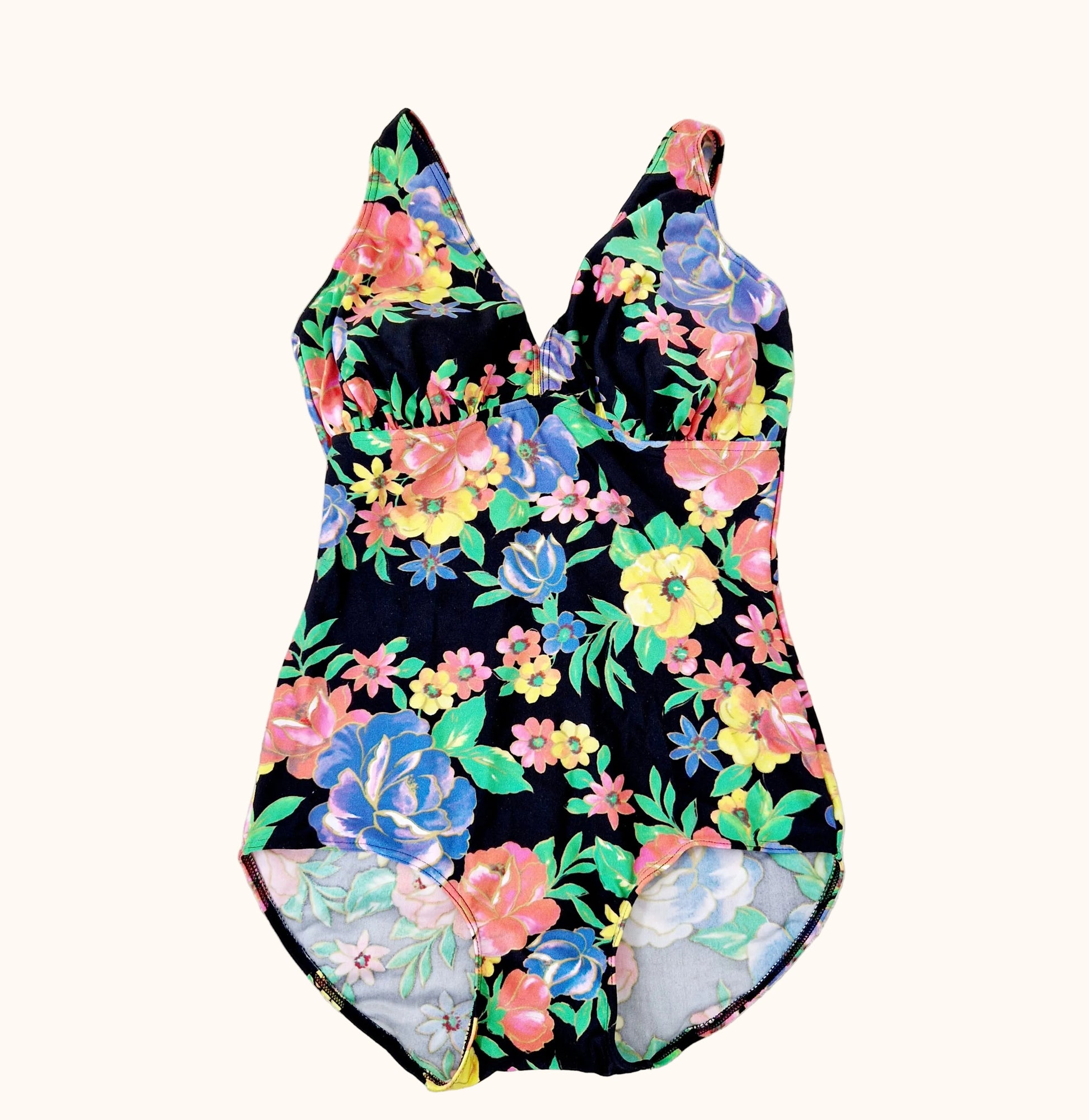 Einzigartiger und nachhaltiger Vintage Badeanzug in schwarz-gelb-rosa mit Blumen. Front.