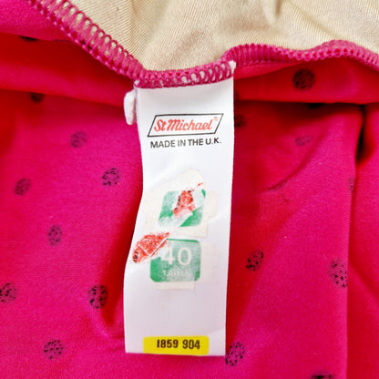 Einzigartiger und nachhaltiger Vintage Badeanzug in pink-schwarz mit Punkten. Tag.