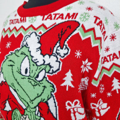 Einzigartiger und nachhaltiger Vintage Pullover in rot-weiss-hellgrün, Grinch. Unique and sustainable vintage pullover in red-white-light green, Grinch. Close-up.