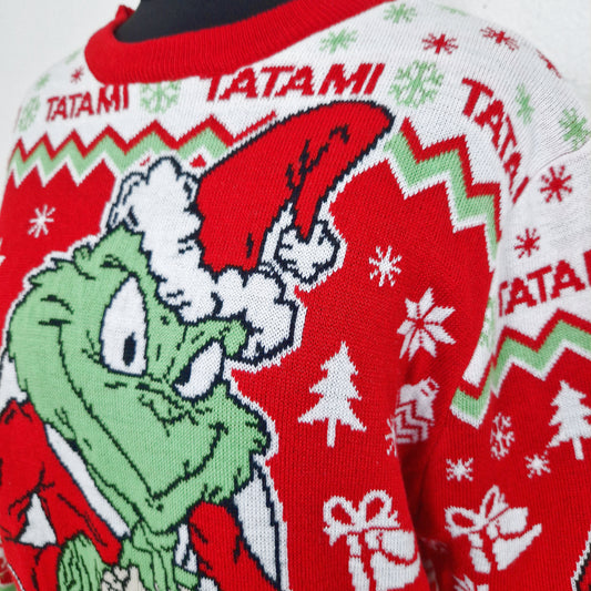 Einzigartiger und nachhaltiger Vintage Pullover in rot-weiss-hellgrün, Grinch. Unique and sustainable vintage pullover in red-white-light green, Grinch. Close-up.