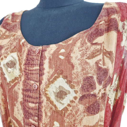 Einzigartiger und nachhaltiger Vintage Jumpsuit in braun-rot-orange mit Ethno-Muster. Close-up.