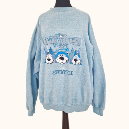 Einzigartiger und nachhaltiger Vintage Pullover in hellblau-türkis-silber mit drei Hunden. Front.